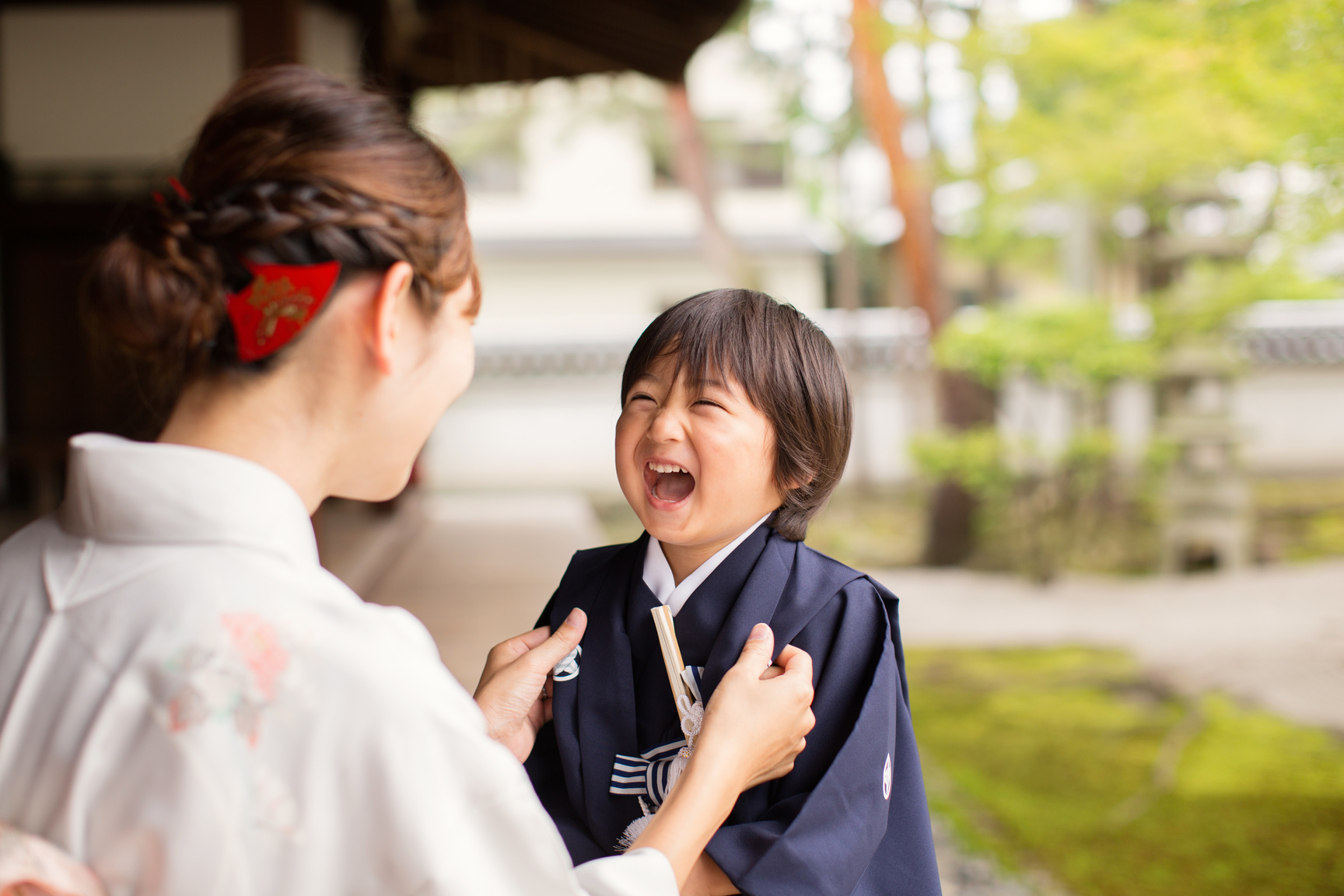 Japanese Boy Laughing with Mother at the Temple Celebrating Shichigosan